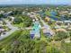Sarasota home with screened-in pool, lush landscaping, and paver patio, offering a luxurious outdoor living experience at 4625 Deer Creek Blvd, Sarasota, FL 34238