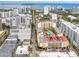 Aerial view of a vibrant city with ocean views, diverse architecture, and bustling streets at 4625 Deer Creek Blvd, Sarasota, FL 34238