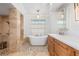 Luxurious bathroom featuring a freestanding tub, glass shower, and detailed tile work at 4625 Deer Creek Blvd, Sarasota, FL 34238