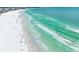 Sarasota's stunning coastline with crystal-clear turquoise waters, white sandy beach, and gentle waves, a true paradise at 4625 Deer Creek Blvd, Sarasota, FL 34238