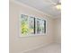 Bright bedroom with white plantation shutters and neutral carpet at 4625 Deer Creek Blvd, Sarasota, FL 34238