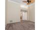 Spacious carpeted bedroom featuring a ceiling fan, white trim, and ensuite bathroom entrance at 4625 Deer Creek Blvd, Sarasota, FL 34238