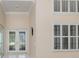 Bright entrance featuring a double glass door, transom windows, and high ceilings at 4625 Deer Creek Blvd, Sarasota, FL 34238