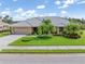 Charming home with lush landscaping, circular driveway and beautiful tile roof at 4625 Deer Creek Blvd, Sarasota, FL 34238