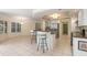 Kitchen featuring island, custom cabinets, stainless appliances and granite countertops at 4625 Deer Creek Blvd, Sarasota, FL 34238