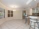 Kitchen featuring island, custom cabinets, stainless appliances and granite countertops at 4625 Deer Creek Blvd, Sarasota, FL 34238