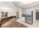 Kitchen featuring granite countertops, stainless steel appliances, and white cabinets with tile flooring at 4625 Deer Creek Blvd, Sarasota, FL 34238