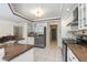 Kitchen with stainless steel appliances, granite countertops, ample cabinet space, and tile flooring at 4625 Deer Creek Blvd, Sarasota, FL 34238