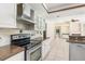 Bright kitchen with stainless appliances, custom cabinets and granite countertops at 4625 Deer Creek Blvd, Sarasota, FL 34238