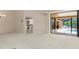 Open living space with sliding doors to lanai and clear view to the next room at 4625 Deer Creek Blvd, Sarasota, FL 34238