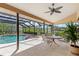 Inviting screened-in patio featuring a pool and spa with ample seating area at 4625 Deer Creek Blvd, Sarasota, FL 34238
