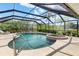 Beautiful backyard with a screened-in pool, attached hot tub, and lounge seating at 4625 Deer Creek Blvd, Sarasota, FL 34238