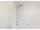 Bathroom shower with a white shower head, tile, and white trim at 4625 Deer Creek Blvd, Sarasota, FL 34238