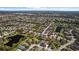 Scenic aerial view of a peaceful community boasting multiple lakes, verdant spaces, and well-maintained properties at 4712 Charles Partin Dr, Parrish, FL 34219
