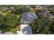 Overhead view of a gray roofed single-Gathering home surrounded by lush landscaping in a well-established community at 4712 Charles Partin Dr, Parrish, FL 34219