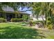 Beautifully landscaped backyard showcasing a patio and lush green lawn, offering a private outdoor oasis at 4712 Charles Partin Dr, Parrish, FL 34219