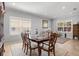 Dining room featuring tile flooring, plantation shutters, a dining table, and comfortable chairs at 4712 Charles Partin Dr, Parrish, FL 34219