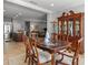 Dining room adjacent to the kitchen, featuring a dining table with seating and views into the living area at 4712 Charles Partin Dr, Parrish, FL 34219