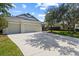 Charming home with a well-maintained exterior, featuring a spacious driveway and a manicured front lawn at 4712 Charles Partin Dr, Parrish, FL 34219