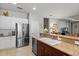 Well-lit kitchen featuring stainless steel appliances and granite countertops at 4712 Charles Partin Dr, Parrish, FL 34219