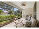 Spacious lanai with ample seating, ceiling fan, and views of the well-maintained backyard at 4712 Charles Partin Dr, Parrish, FL 34219