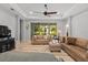 Bright living room with tile floors, neutral paint, and comfortable furnishings at 4712 Charles Partin Dr, Parrish, FL 34219