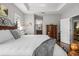 Comfortable main bedroom featuring tray ceilings and an ensuite bathroom at 4712 Charles Partin Dr, Parrish, FL 34219