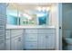 Charming bathroom featuring vanity with dual mirrors and bright vanity lights at 4812 Kestral Park Cir # 20, Sarasota, FL 34231