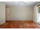 Bedroom featuring terracotta tile flooring, a ceiling fan, and bright natural light at 4812 Kestral Park Cir # 20, Sarasota, FL 34231