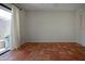 Bedroom with terracotta tile flooring, sliding glass door, and bright natural light at 4812 Kestral Park Cir # 20, Sarasota, FL 34231