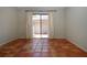 Bedroom featuring terracotta tile flooring, sliding glass door, and bright natural light at 4812 Kestral Park Cir # 20, Sarasota, FL 34231
