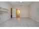 Bright bedroom with tiled floor, neutral walls, ceiling fan and ensuite bath access at 4812 Kestral Park Cir # 20, Sarasota, FL 34231
