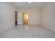Bright bedroom with tiled floor, neutral walls, ceiling fan and ensuite bath access at 4812 Kestral Park Cir # 20, Sarasota, FL 34231