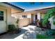 Home's entryway with brick pathway and beautiful landscaping at 4812 Kestral Park Cir # 20, Sarasota, FL 34231