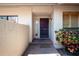 Home's front entrance with brick landing and landscaping at 4812 Kestral Park Cir # 20, Sarasota, FL 34231