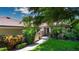 Charming home with lush landscaping and a well-maintained lawn at 4812 Kestral Park Cir # 20, Sarasota, FL 34231
