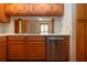 Traditional kitchen featuring stainless steel appliances, wood cabinets, and light countertops at 4812 Kestral Park Cir # 20, Sarasota, FL 34231