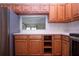Traditional kitchen featuring stainless steel appliances, wood cabinets, and light countertops at 4812 Kestral Park Cir # 20, Sarasota, FL 34231
