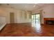 Bright living room with Saltillo tile, built-in shelving, and fireplace at 4812 Kestral Park Cir # 20, Sarasota, FL 34231