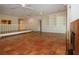 Large living area featuring Saltillo tile, fireplace, built-in shelving, and open floor plan at 4812 Kestral Park Cir # 20, Sarasota, FL 34231