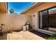 Enclosed patio with brick flooring and a water filtration system at 4812 Kestral Park Cir # 20, Sarasota, FL 34231