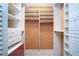 Custom walk-in closet featuring built in shelving and pull out drawers at 4812 Kestral Park Cir # 20, Sarasota, FL 34231