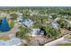 Aerial view of the home featuring a screened pool, backyard, and surrounding neighborhood at 4907 4Th Avenue Nw Cir, Bradenton, FL 34209