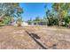 Large backyard with a screened-in pool and ample space for outdoor activities at 4907 4Th Avenue Nw Cir, Bradenton, FL 34209
