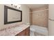 Bathroom featuring a vanity with granite counters, tiled shower, and toilet at 4907 4Th Avenue Nw Cir, Bradenton, FL 34209
