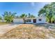 Inviting single-story home with a two-car garage, clean white exterior, and a neatly maintained yard at 4907 4Th Avenue Nw Cir, Bradenton, FL 34209