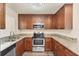 Well-equipped kitchen featuring granite countertops, stainless steel appliances, ample cabinet space and modern fixtures at 4907 4Th Avenue Nw Cir, Bradenton, FL 34209
