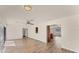 Bright living room featuring wood floors, ceiling fan, and an open floor plan at 4907 4Th Avenue Nw Cir, Bradenton, FL 34209