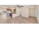 Spacious living area flowing into an updated kitchen, featuring stainless steel appliances and an inviting breakfast bar at 4907 4Th Avenue Nw Cir, Bradenton, FL 34209