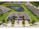 Overhead view of homes near a pond with beautiful landscaping and easy access to community features at 5237 Blossom Cv, Lakewood Ranch, FL 34211